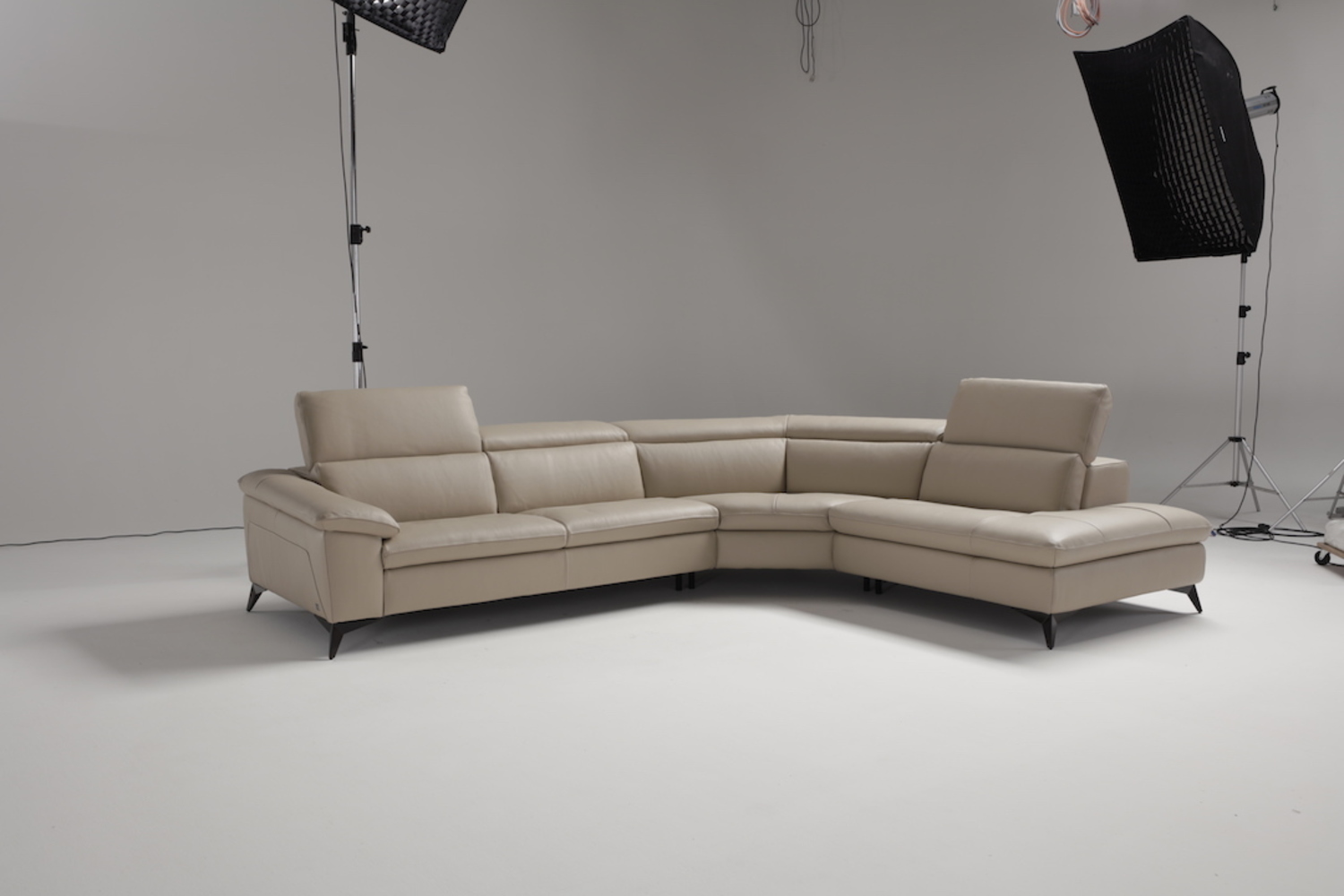 Martine, Leather Sectional with Mechanical Headrest Mechanism.